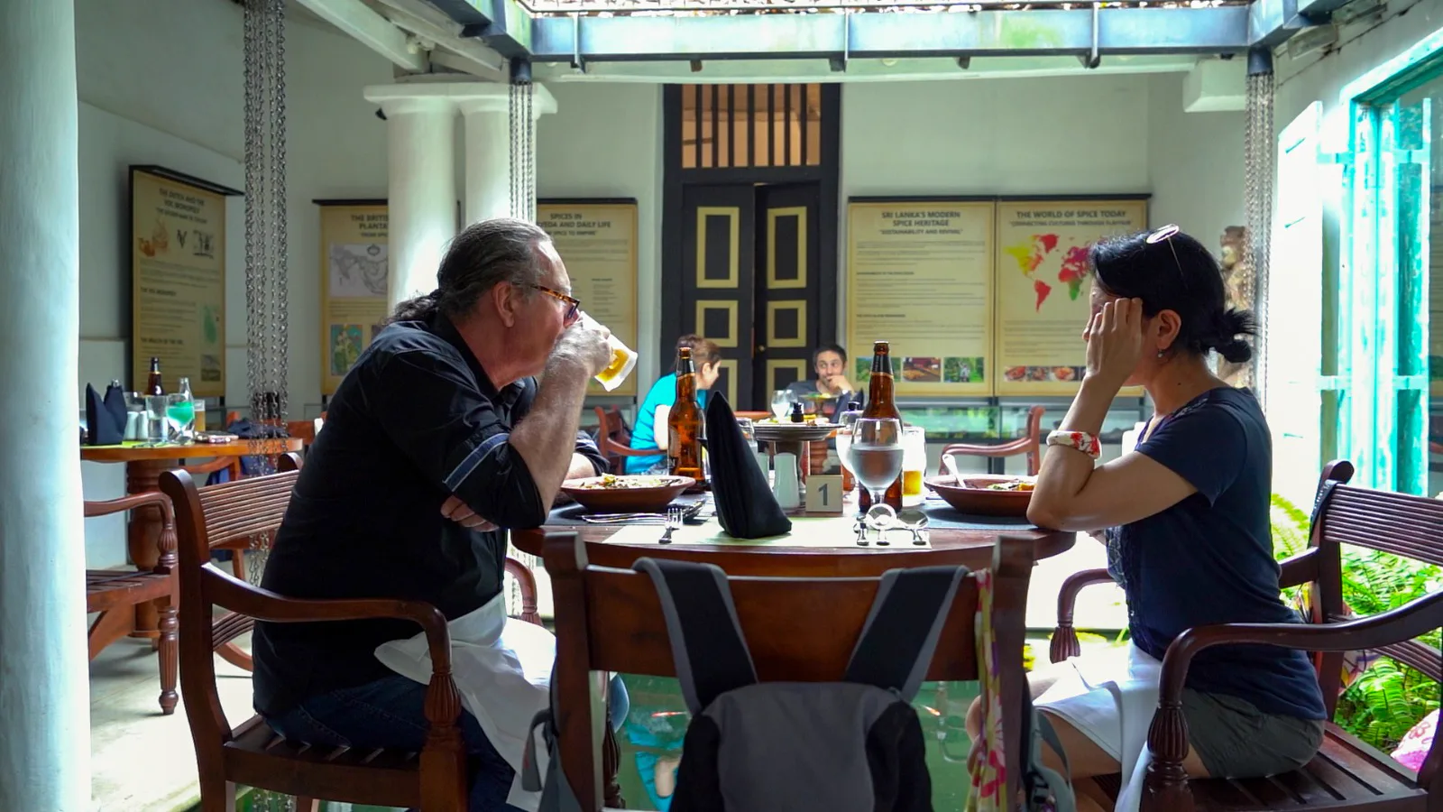 Guests dining beside interpretive panels on Sri Lanka's spice heritage